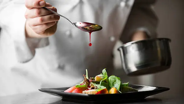Professional male and female cooks preparing fresh Pakistani, Chinese, and Continental meals in a home kitchen. Crown Employment Services provides trusted, verified cooks and chefs for households in Islamabad and Rawalpindi.